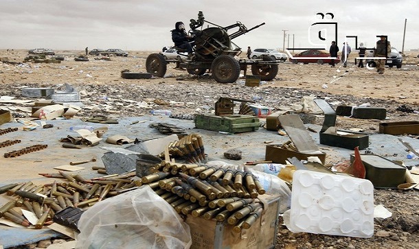 A rebel mans an anti-aircraft gun in Ras Lanuf